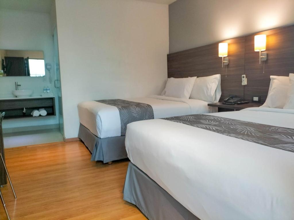 Postel nebo postele na pokoji v ubytování El Hotel Business Class - Zamora Centro