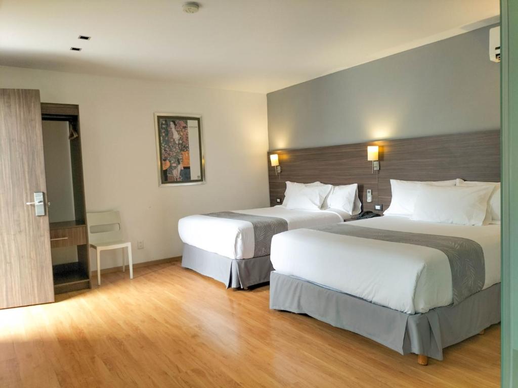 Postel nebo postele na pokoji v ubytování El Hotel Business Class - Zamora Centro
