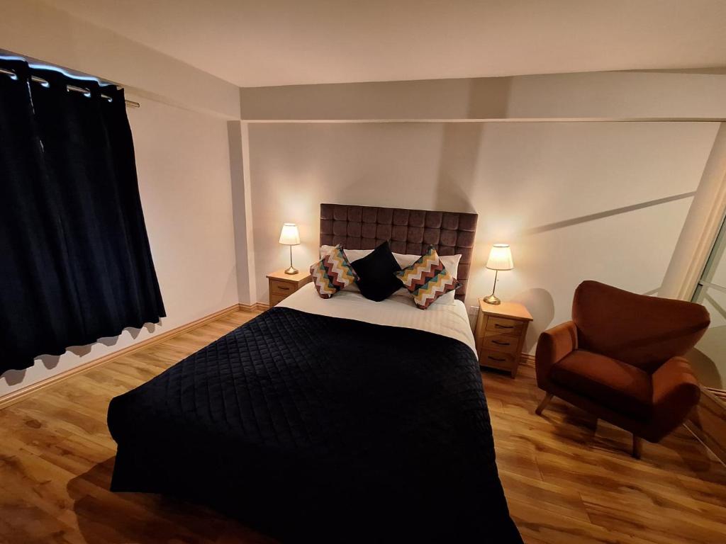Posteľ alebo postele v izbe v ubytovaní Five Lamps Suites