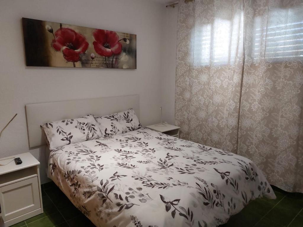 Giường trong phòng chung tại APARTAMENTOS SURYCAN