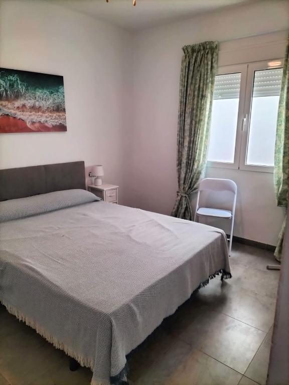 A bed or beds in a room at ApartiaBeach Apartamentos