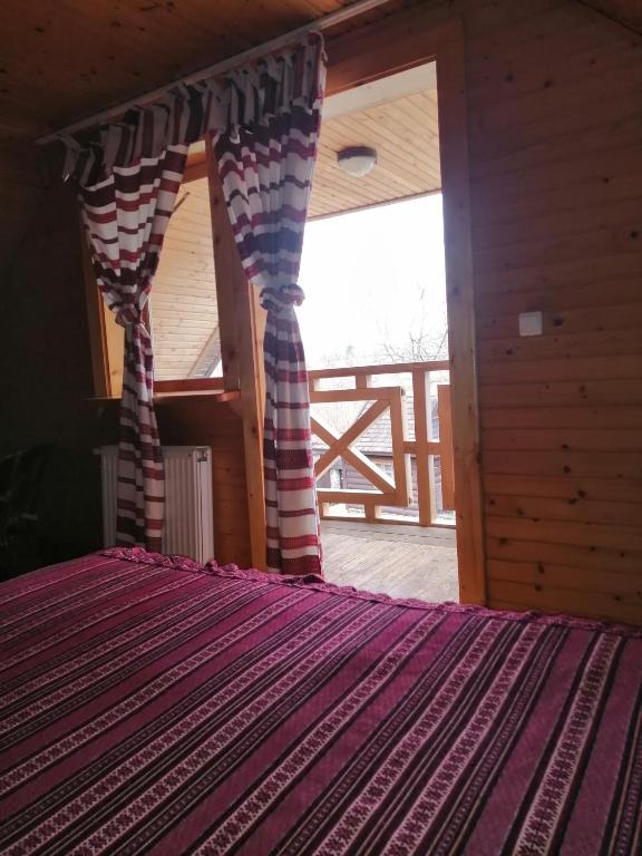 Postel nebo postele na pokoji v ubytování Stara Khata Карпати