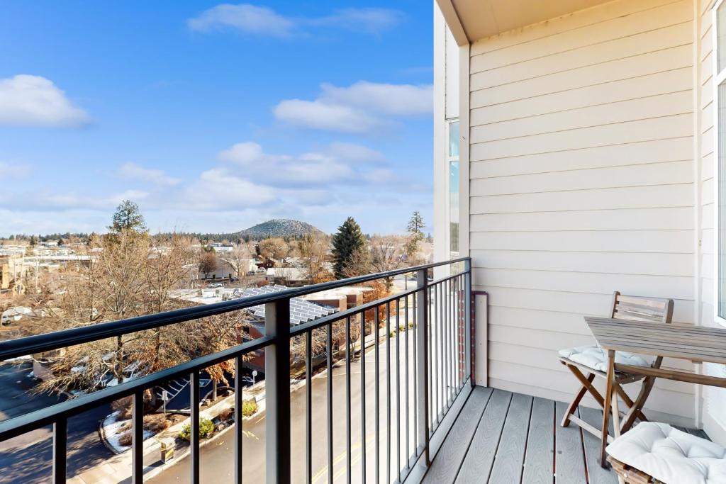 a balcony with a bench and a view at Putnam Pointe Perch #510 in Bend