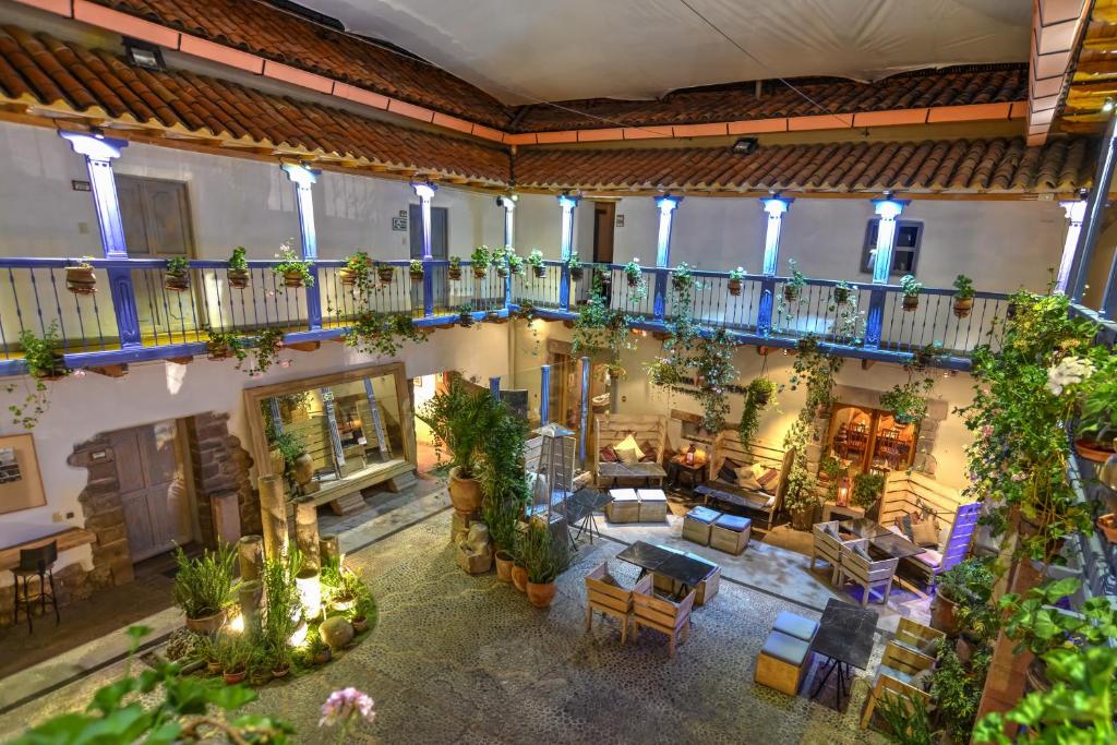 an overhead view of a living room with plants at ARQUEOLOGO EXCLUSIVE SELECTION - Casa Peralta in Cusco