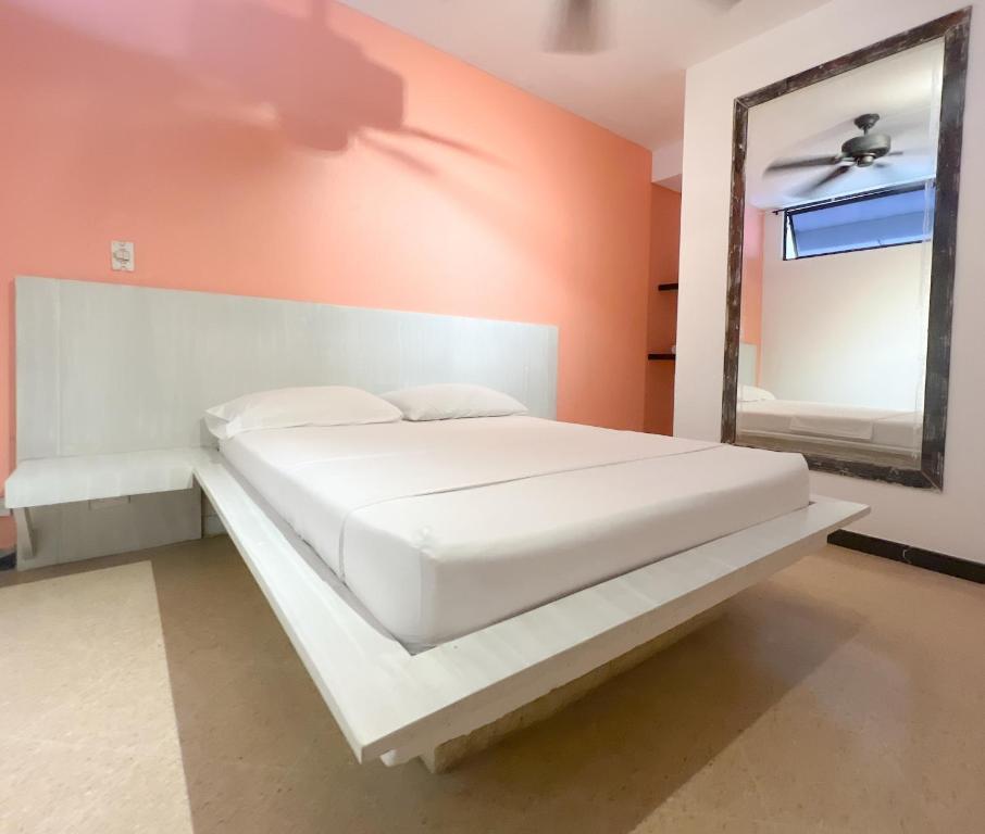 Postel nebo postele na pokoji v ubytování Green Hotel Natural Medellin