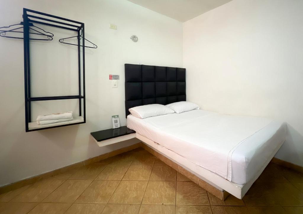 Postel nebo postele na pokoji v ubytování Green Hotel Natural Medellin