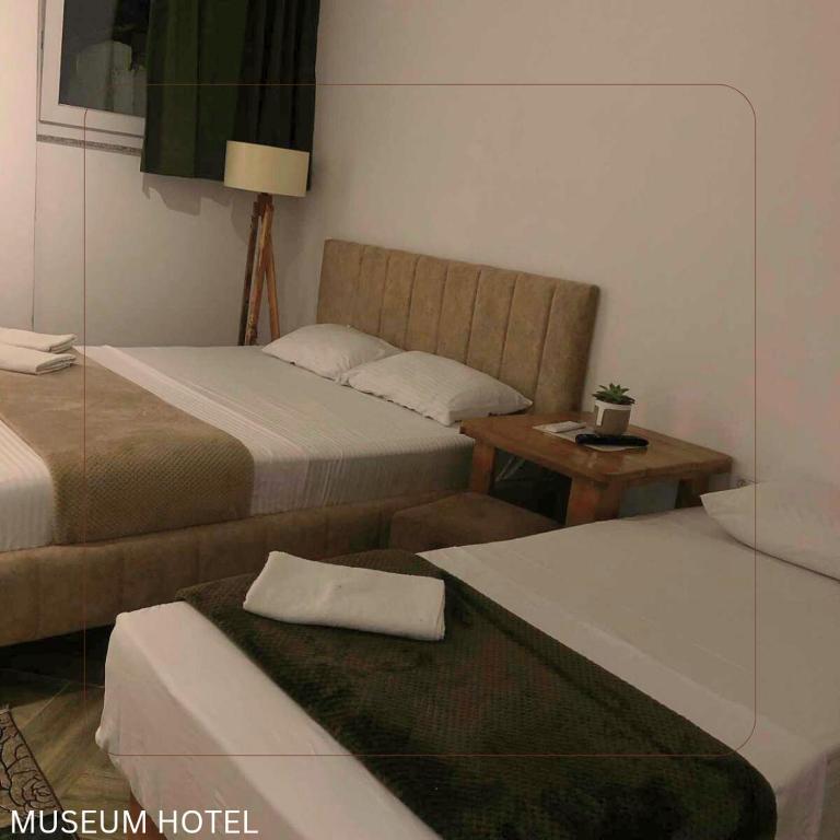 Postel nebo postele na pokoji v ubytování Museum Hotel