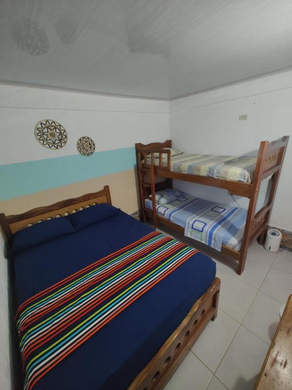 Postel nebo postele na pokoji v ubytování Milimar Hostal