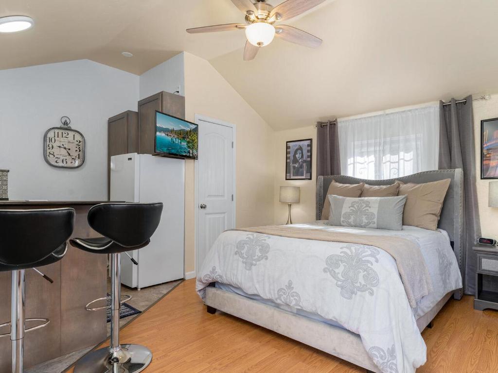 a bedroom with a bed and a ceiling fan at Reno Studio Gem: Cozy Netflix Free Parking in Reno