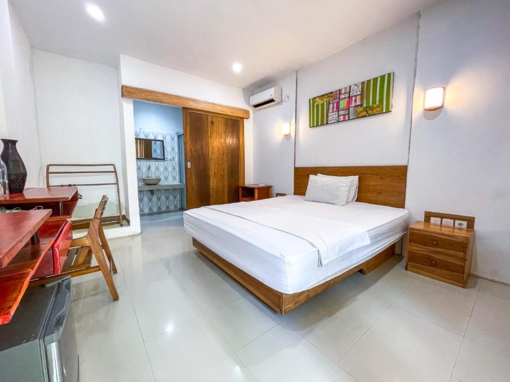 Postel nebo postele na pokoji v ubytování Lara Homestay