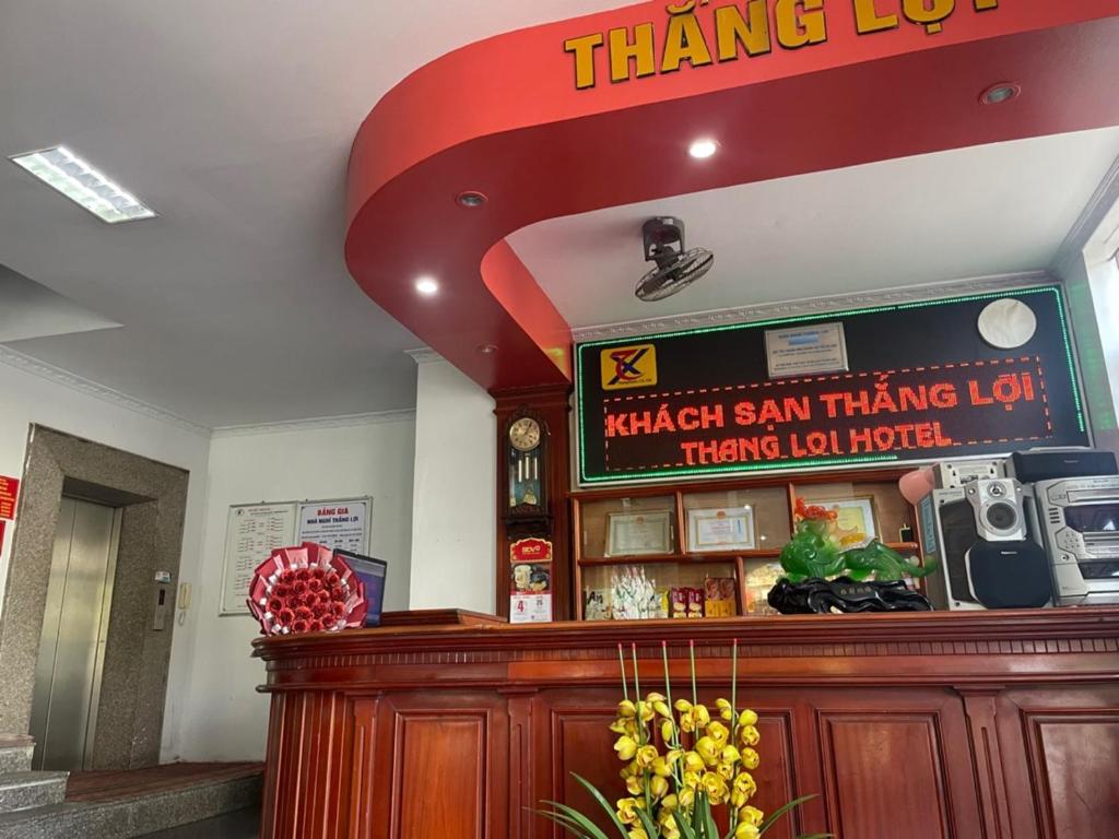a thai restaurant with a sign above a counter at Thắng Lợi Hotel in Thanh Hóa