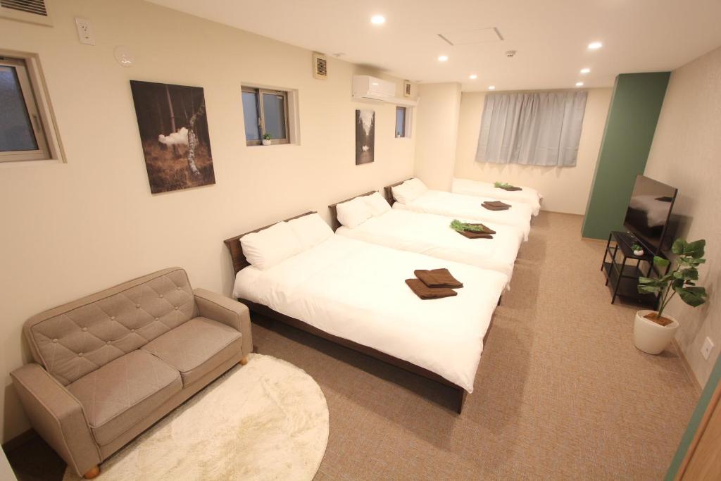 LUANAHOTEL IN KOUENJIにあるベッド