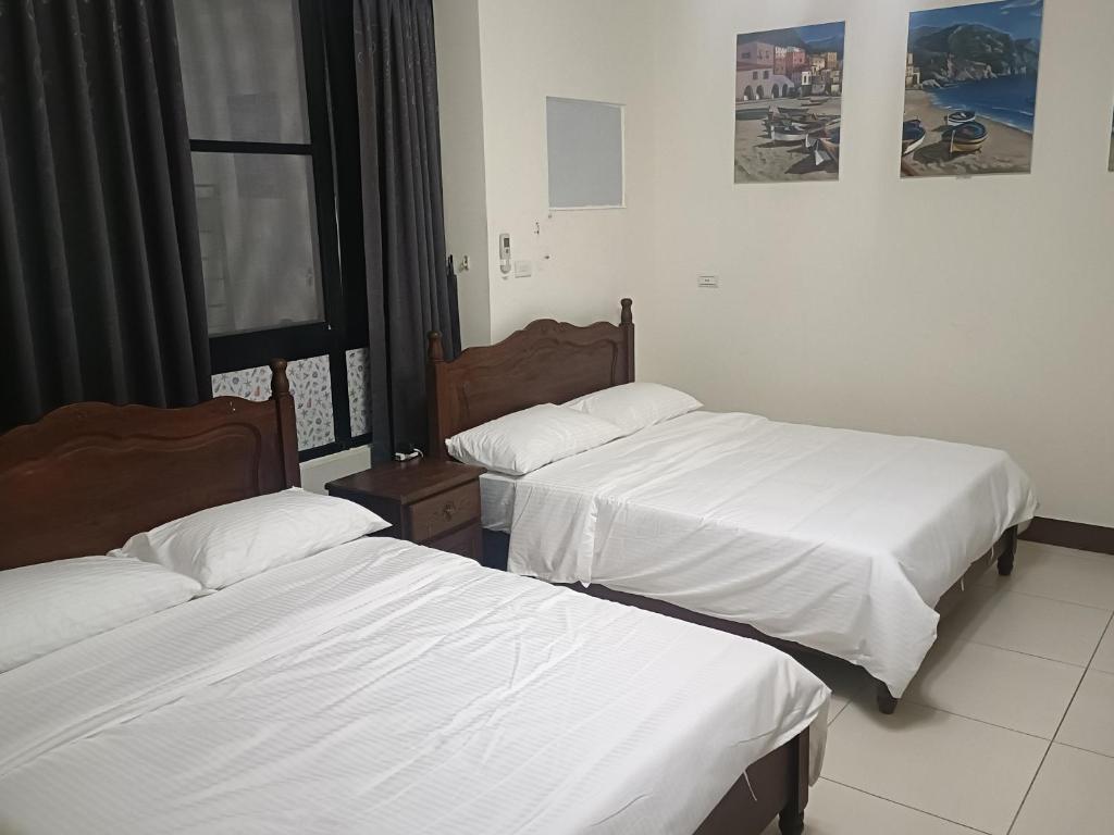 Postel nebo postele na pokoji v ubytování Yan Gui Lai B&B