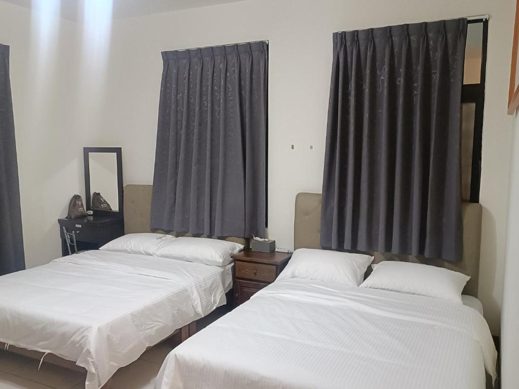 Postel nebo postele na pokoji v ubytování Yan Gui Lai B&B