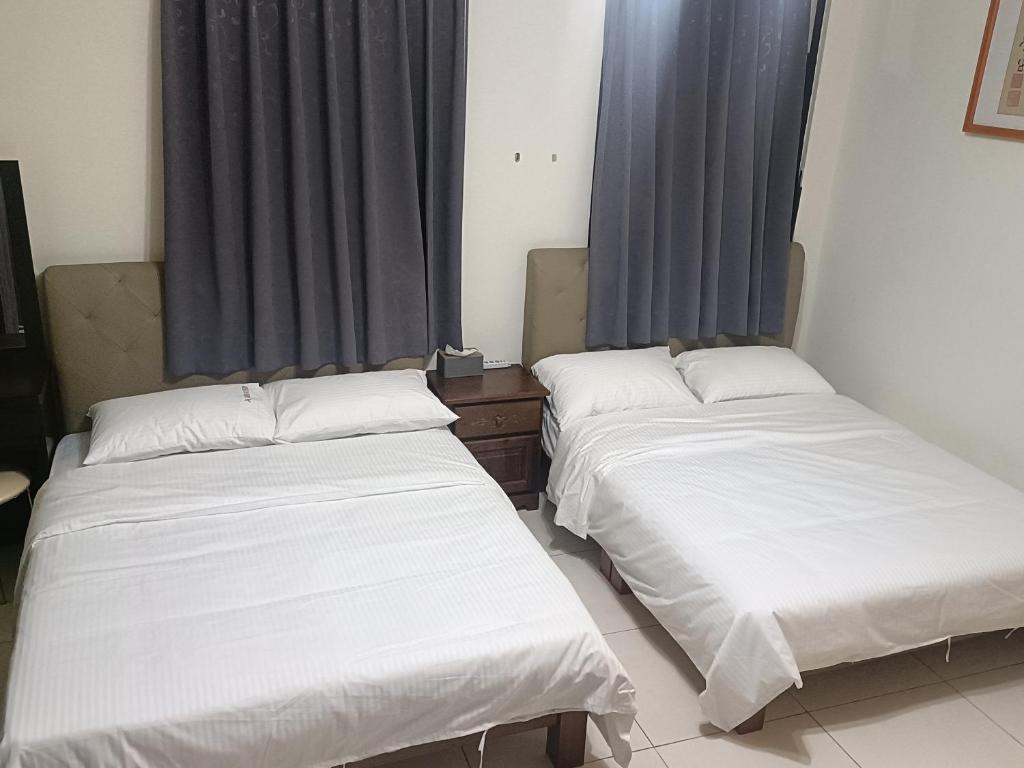 Postel nebo postele na pokoji v ubytování Yan Gui Lai B&B