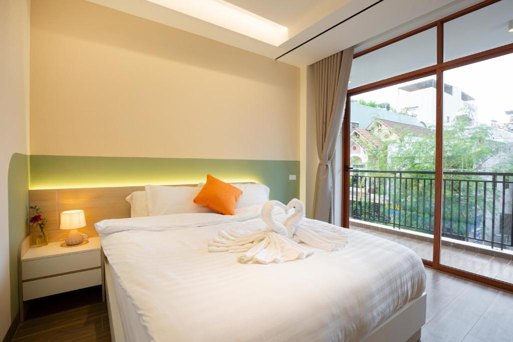 Postel nebo postele na pokoji v ubytování Sonder Homestay Quy Nhon