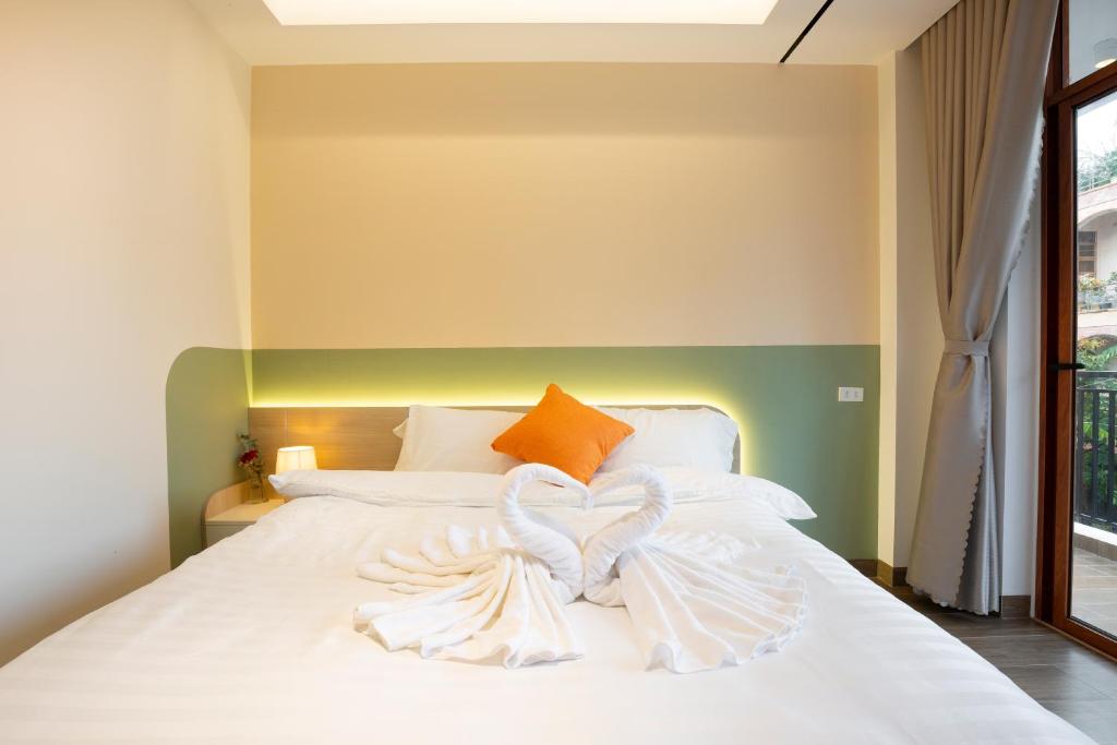 Postel nebo postele na pokoji v ubytování Sonder Homestay Quy Nhon