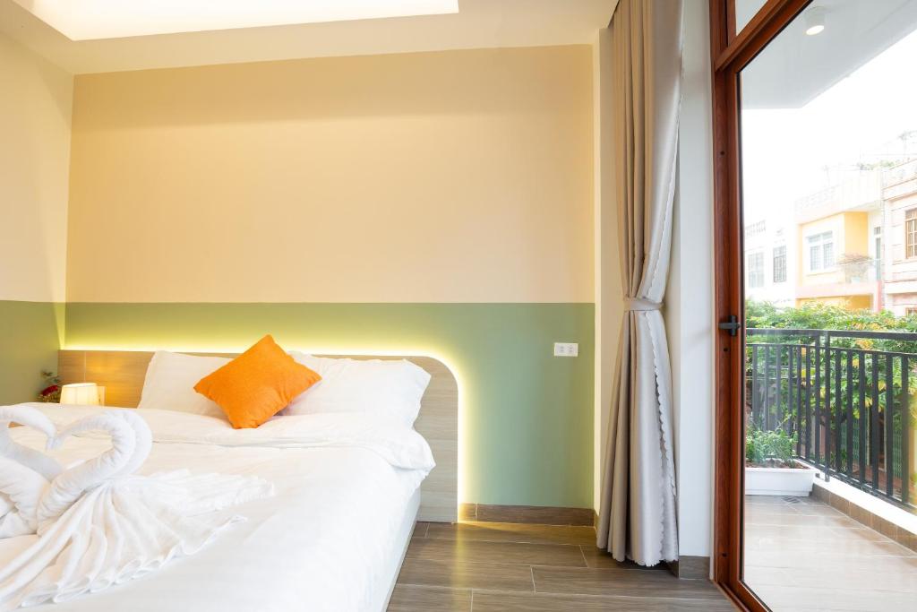 Postel nebo postele na pokoji v ubytování Sonder Homestay Quy Nhon