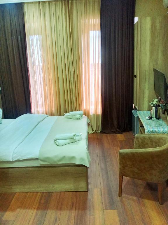 Postel nebo postele na pokoji v ubytování Epic Meidan Hotel