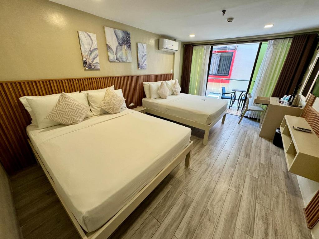 Postel nebo postele na pokoji v ubytování Red Coco Inn de Boracay
