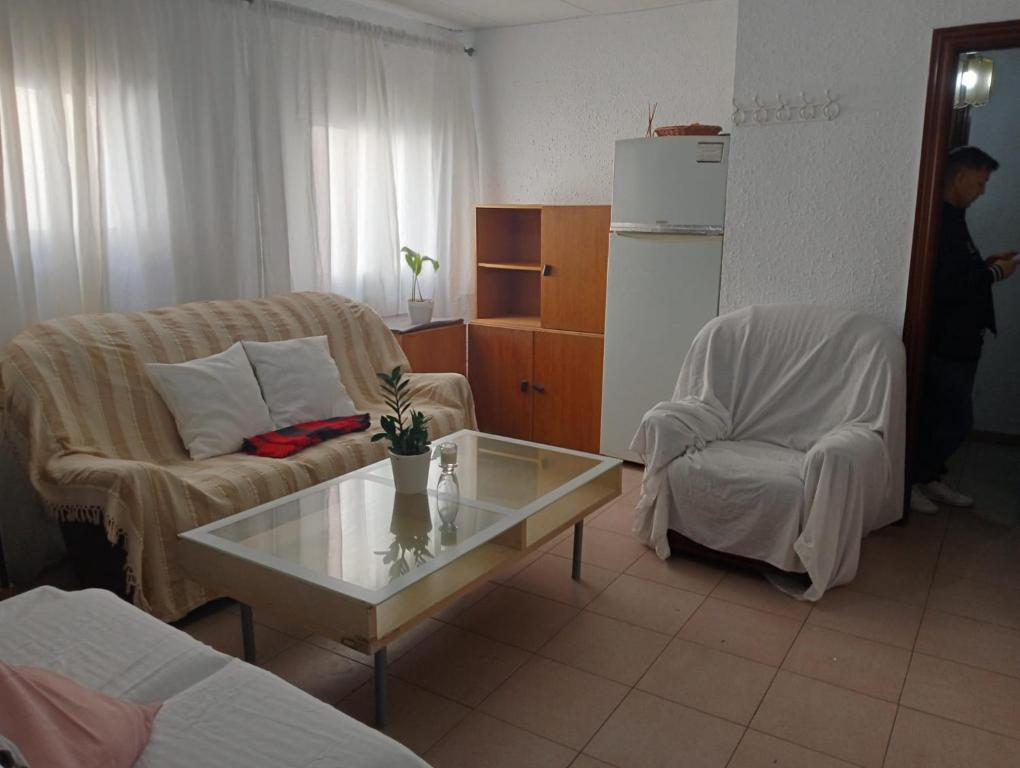 a living room with a couch and a coffee table at Barcelona Appartment in Santa Coloma de Gramanet