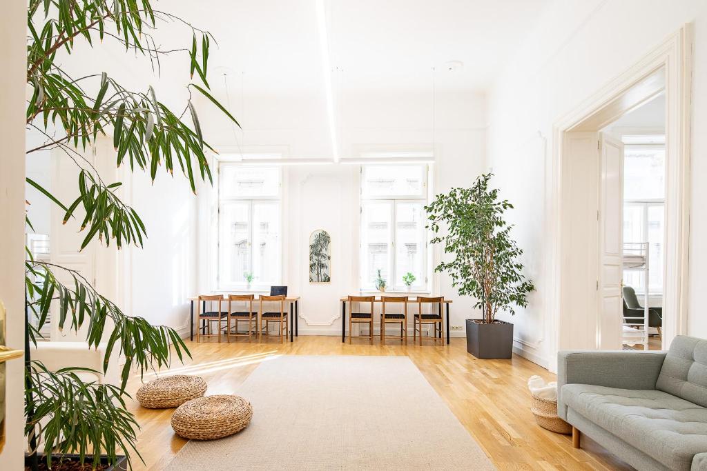 a living room with a couch and a table at Jupiter Home Buda in Budapest