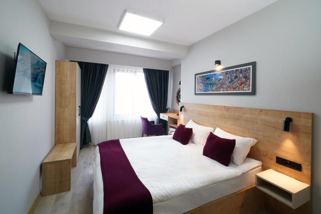 a hotel room with a bed and a window at Meet İstanbul Hotel Kadikoy in Istanbul