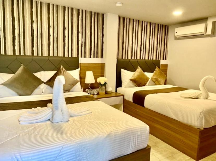 Giường trong phòng chung tại VIEDA HOTEL