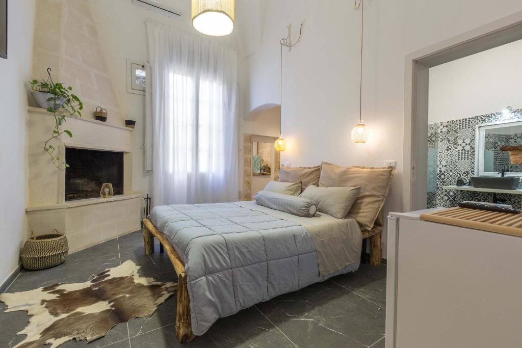 a bedroom with a bed and a couch in it at Dongiovanni Suite in Lecce