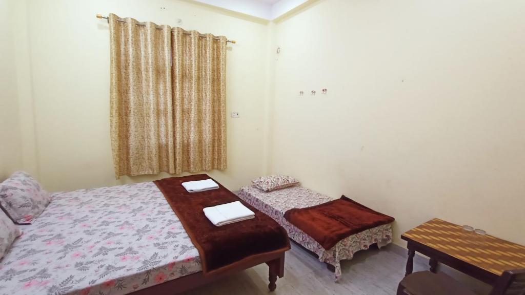 Voodi või voodid majutusasutuse ARJUN PAYING GUEST HOUSE toas