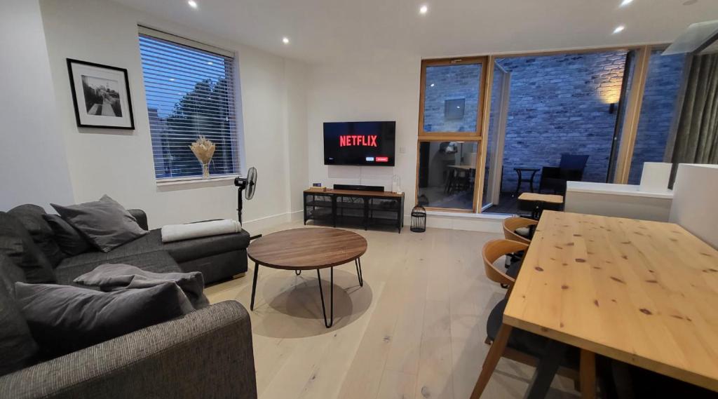 a living room with a couch and a table at Central London penthouse apartment in London