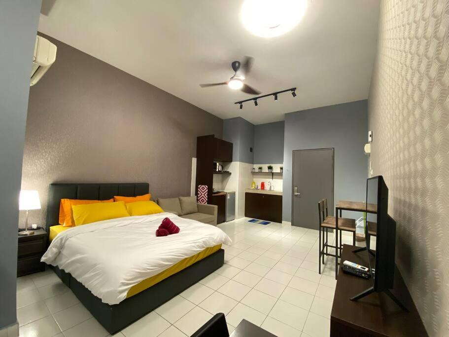 a bedroom with a bed and a living room at 5mins to Sunway #Subang SS15 Stylish Studio #3pax in Subang Jaya