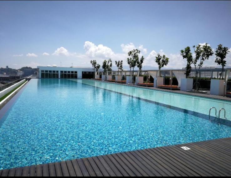a large swimming pool on top of a building at Sutera Luxurious Loft 1 in Kota Kinabalu