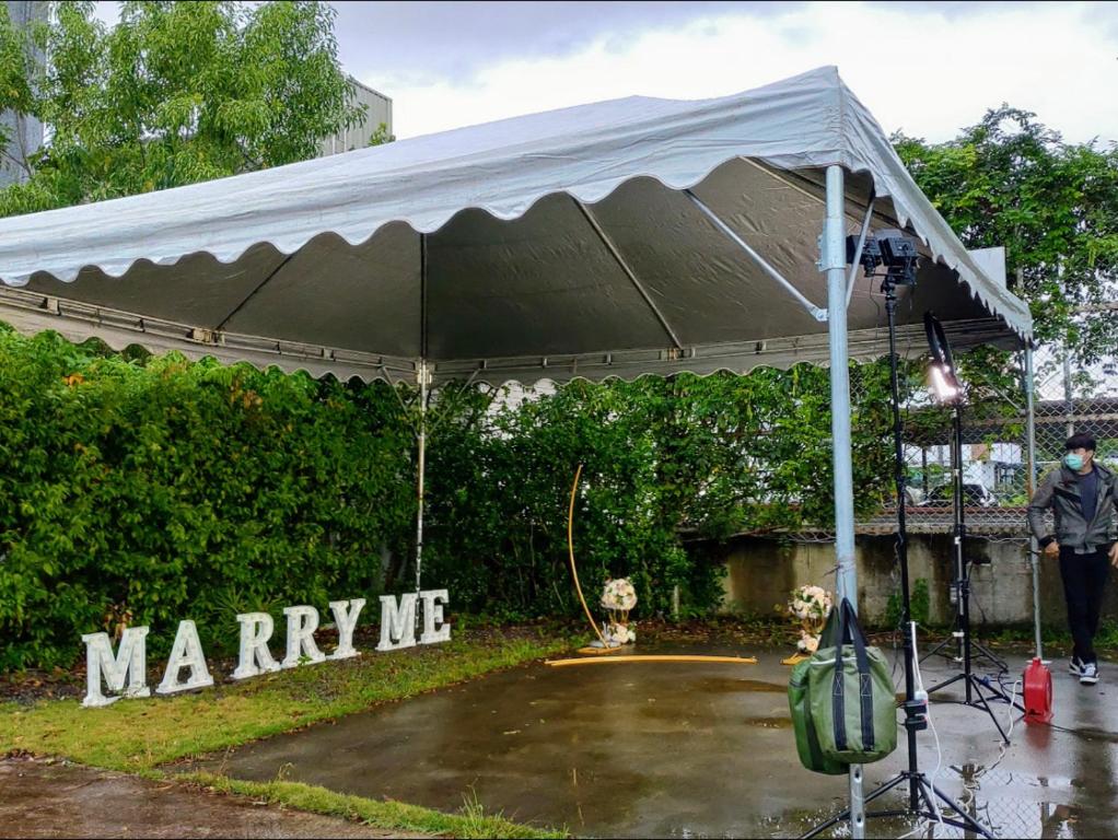 a white tent with a dog under it at I Leisure B&amp;B in Yuanshan