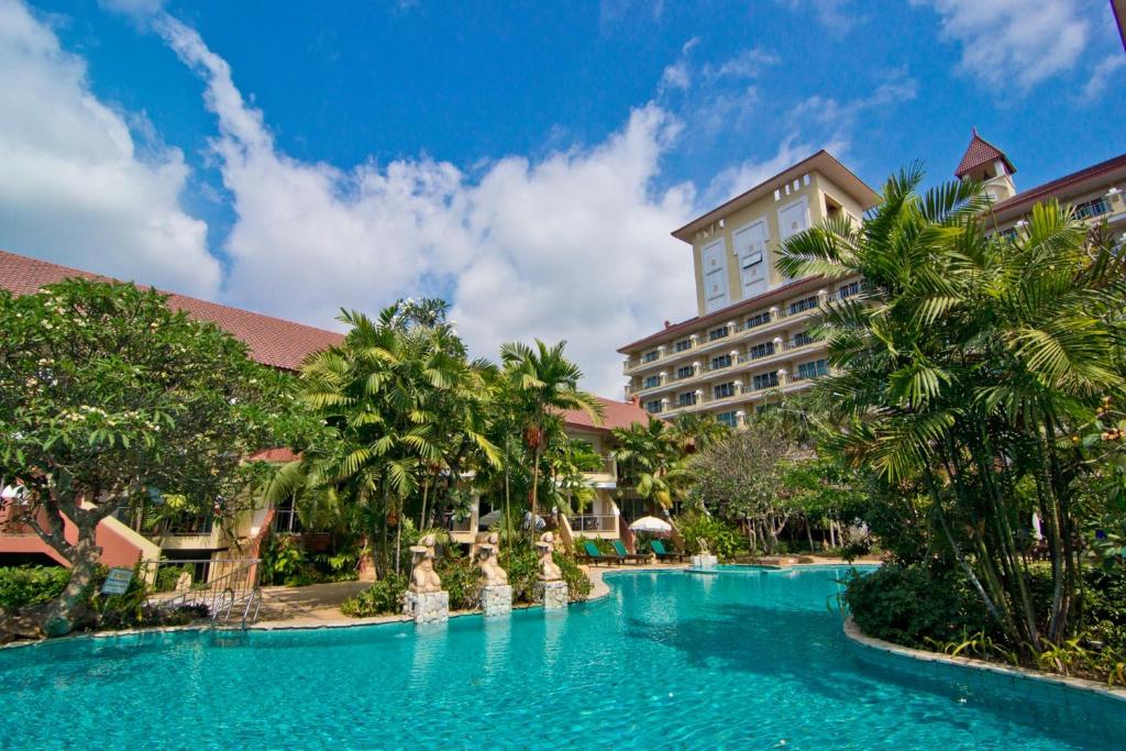 a swimming pool in front of a resort at Bella Villa Cabana in Naklua 