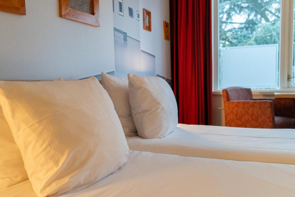 Postel nebo postele na pokoji v ubytování Kruller - Hotel B&B