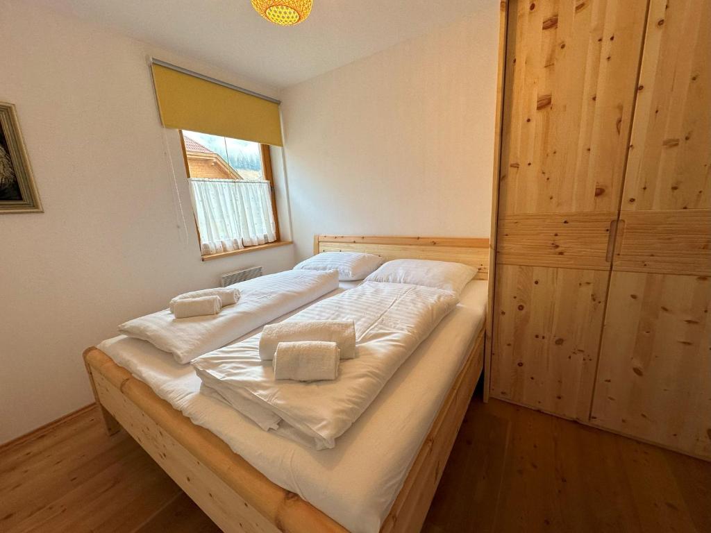 Postel nebo postele na pokoji v ubytování SKI-TO-DOOR Sonnwiese