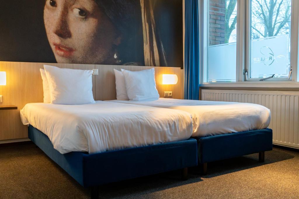Postel nebo postele na pokoji v ubytování Kruller - Hotel B&B
