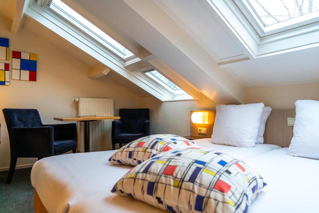 Postel nebo postele na pokoji v ubytování Kruller - Hotel B&B