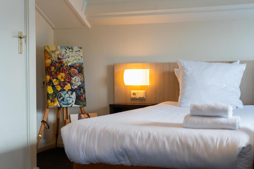 Postel nebo postele na pokoji v ubytování Kruller - Hotel B&B