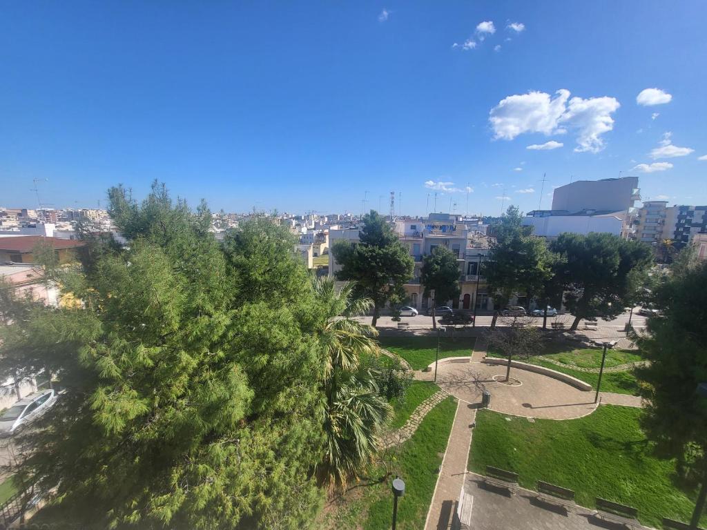 a view of a park with trees and buildings at Santa Maria Vetere in Andria