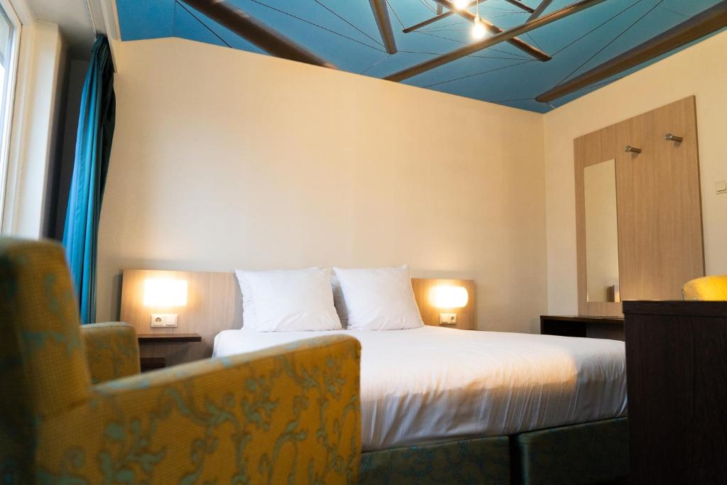 Postel nebo postele na pokoji v ubytování Kruller - Hotel B&B