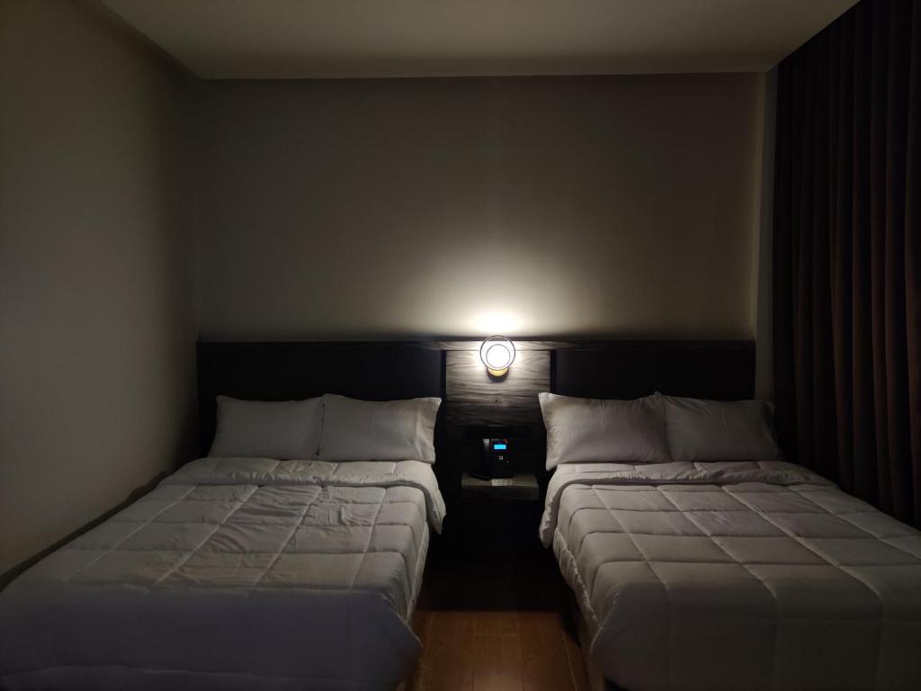 Postel nebo postele na pokoji v ubytování Altori Park Hotel