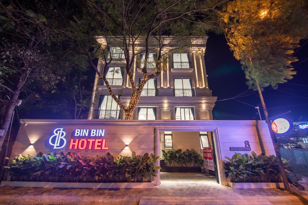 a hotel building with a sign in front of it at Bin Bin Hotel 11 Near Island Diamond in Ho Chi Minh City