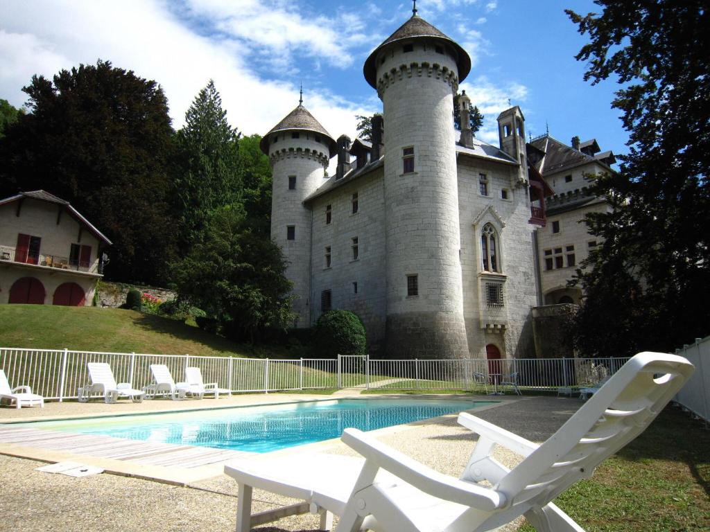 a castle with a swimming pool in front of it at Delightful Villa at Moriani Plage with Garden in San-Nicolao