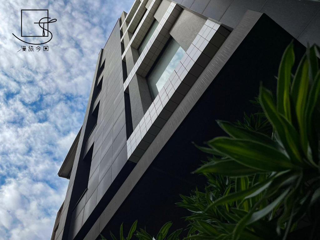 a tall building with the sky in the background at Konkai Inn in Tainan