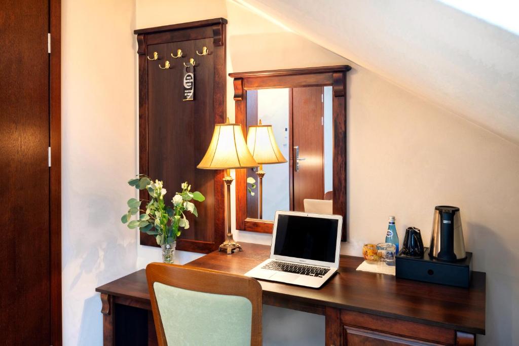 Televízia a/alebo spoločenská miestnosť v ubytovaní Residence 9