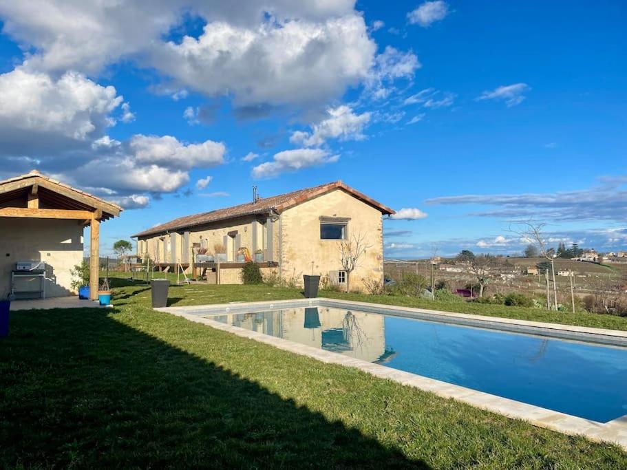 a house with a swimming pool in a yard at Domaine Clos Carron Studio 2 personnes L&#39;Olivier in Saint-Amour-Bellevue