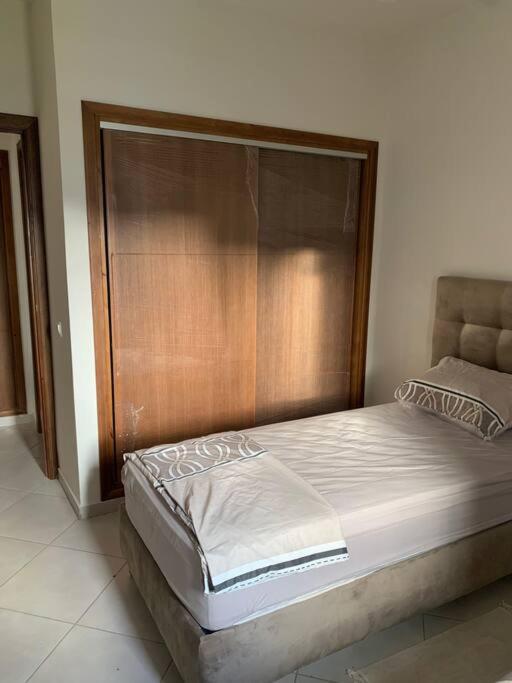 Postel nebo postele na pokoji v ubytování Superbe appartement neuf en résidence avec piscine