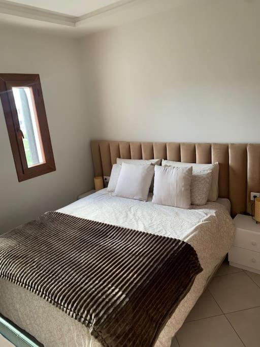 Postel nebo postele na pokoji v ubytování Superbe appartement neuf en résidence avec piscine